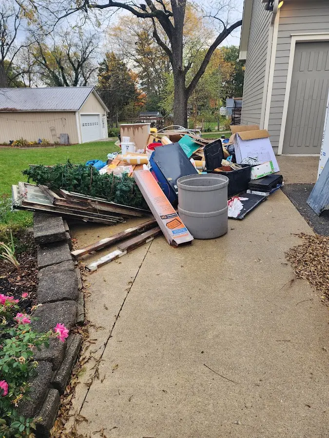 Dumpster being loaded with debris for Residential Dumpster Rental in Evergreen